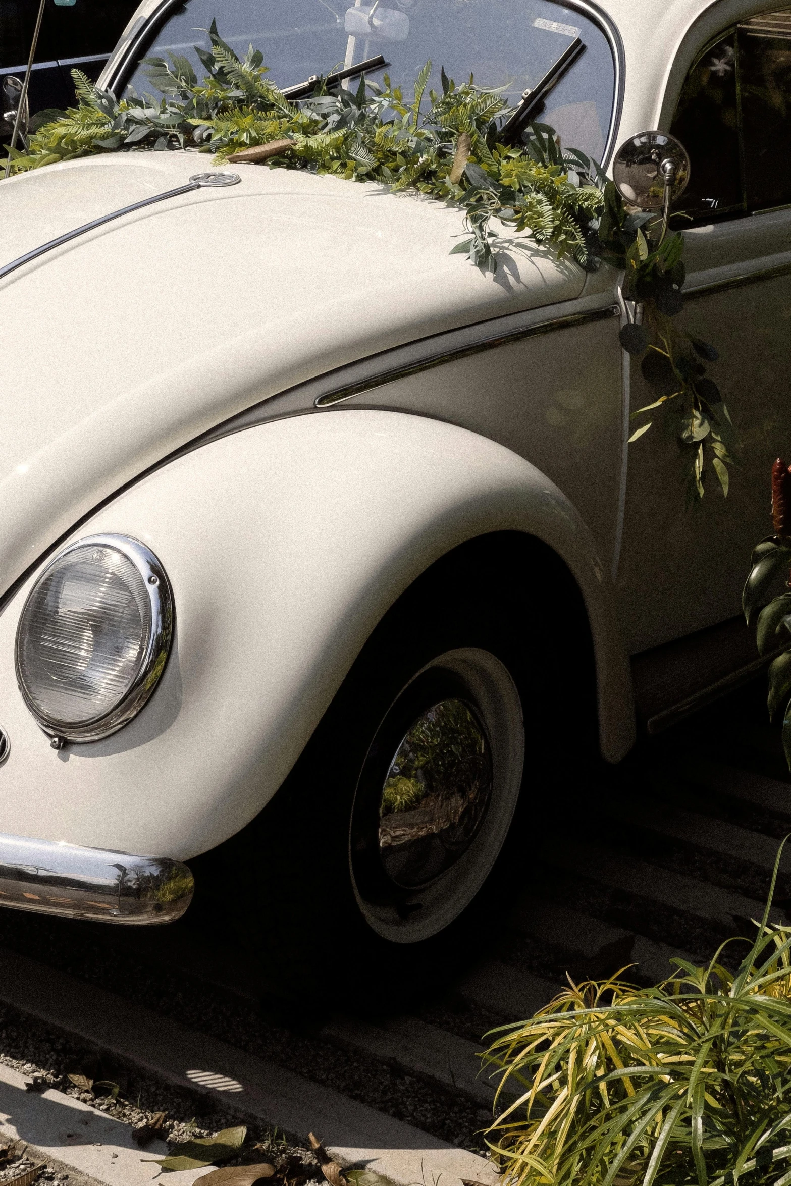 a vintage vw bug parked in a parking lot