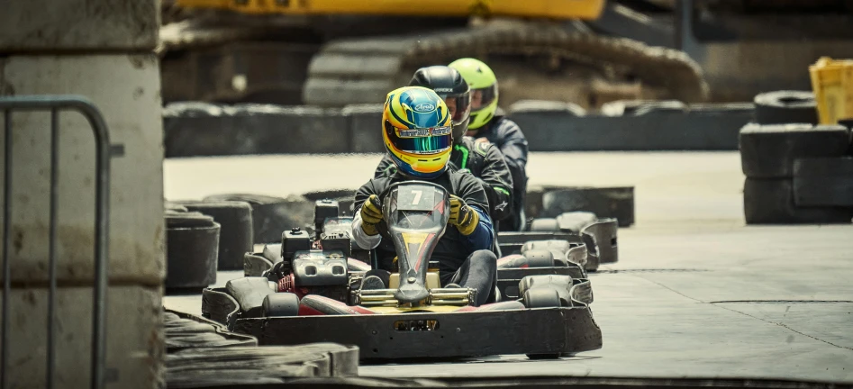 some race goers racing cars in an urban street