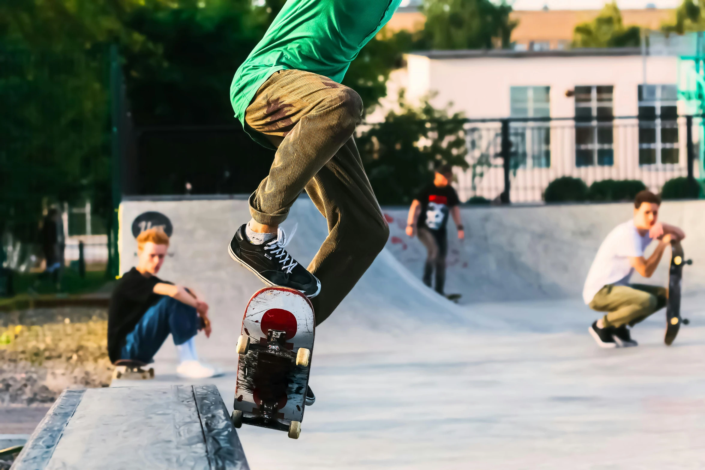 a skateboarder does tricks while others look on