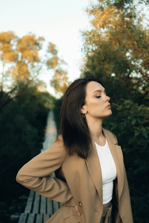 a woman standing on top of a wooden ramp