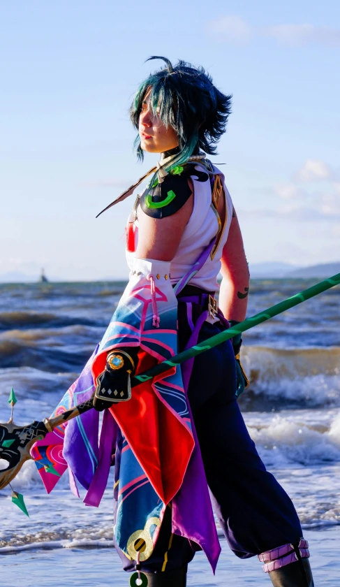 a woman standing in the water holding a large paddle