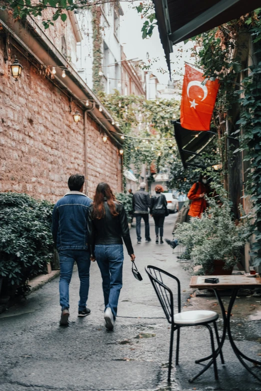 two people walking in a path in the city