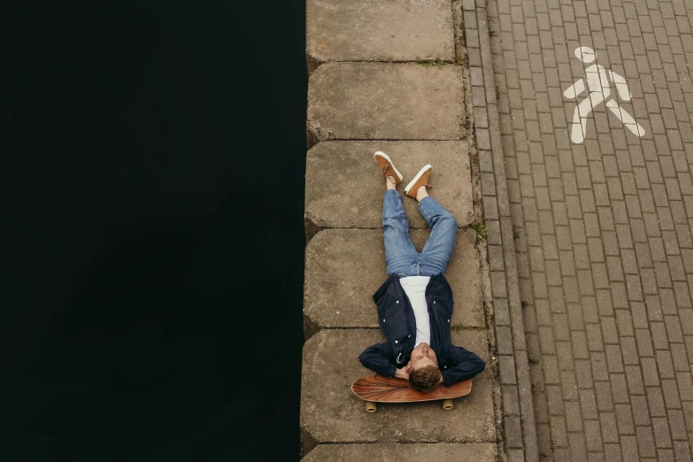 an aerial view of a man on a skate board