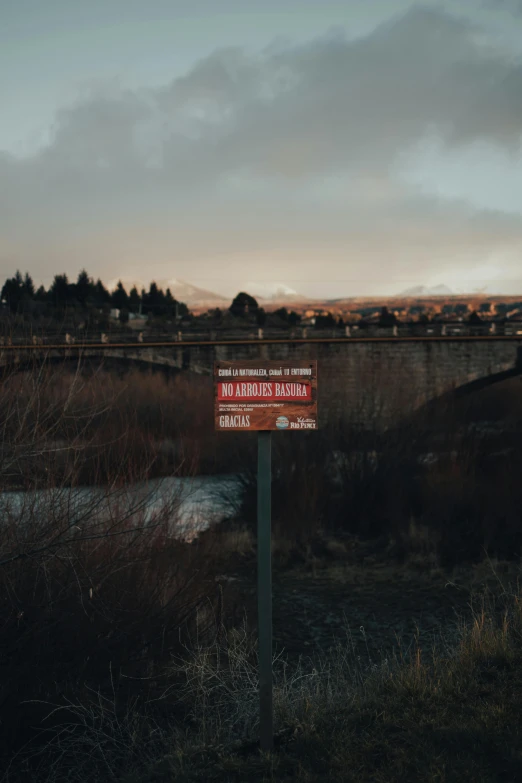 this is a picture of the side of a train track at dusk