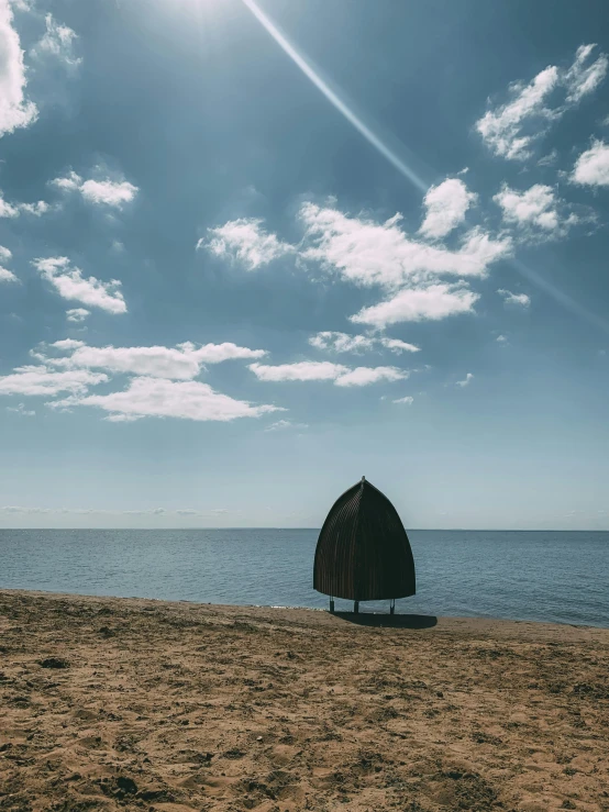 the sun shines brightly behind a brown gazebo