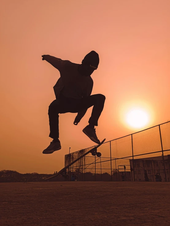 a man flying through the air while riding a skateboard