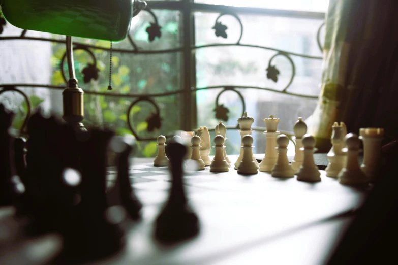 a chess board and its pieces on a table