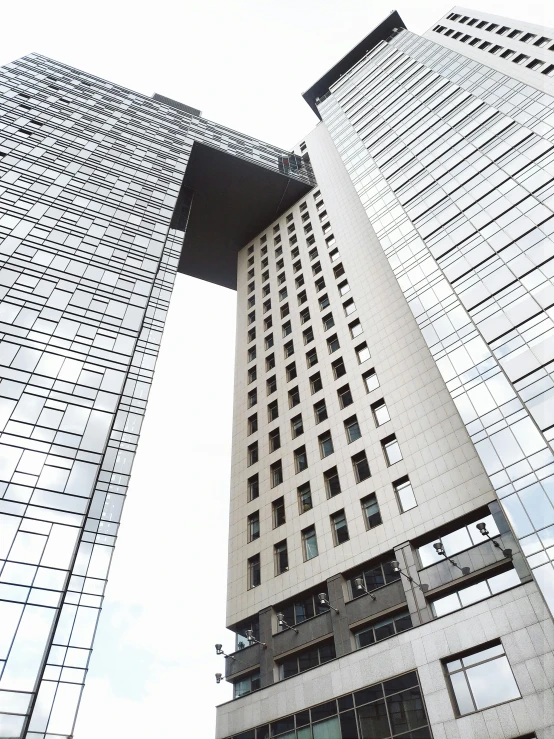 two large tall buildings standing next to each other