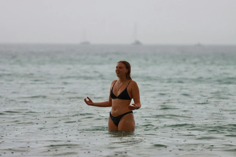 a women who is standing in some water