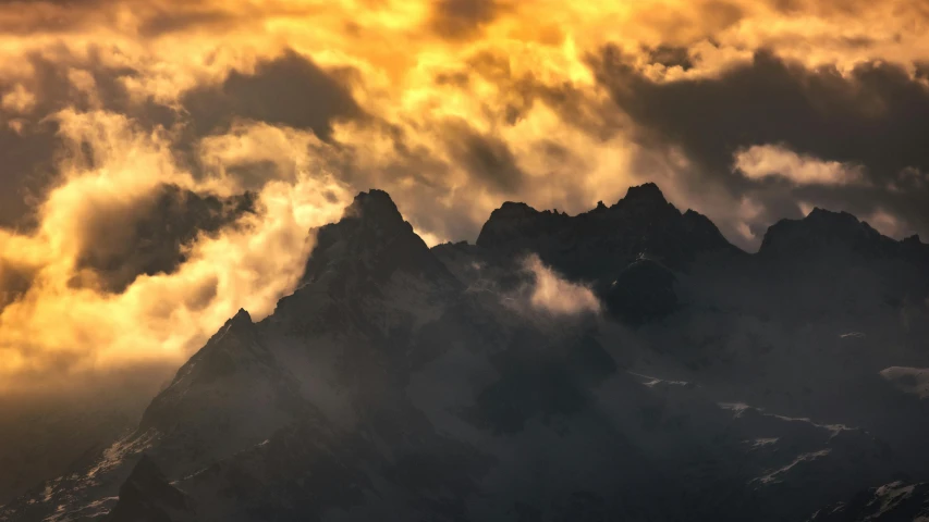 a mountain peak in the distance with storm clouds