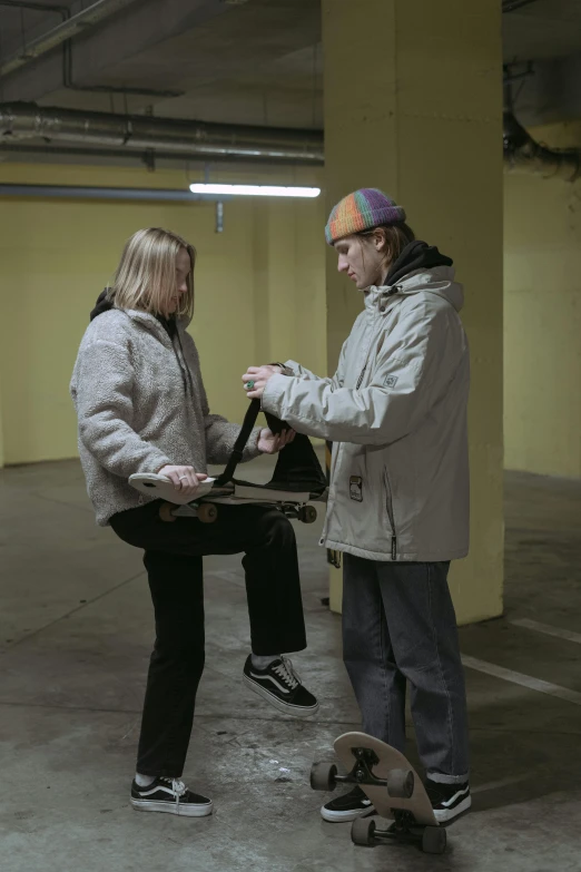 a couple is sitting on a chair talking to each other