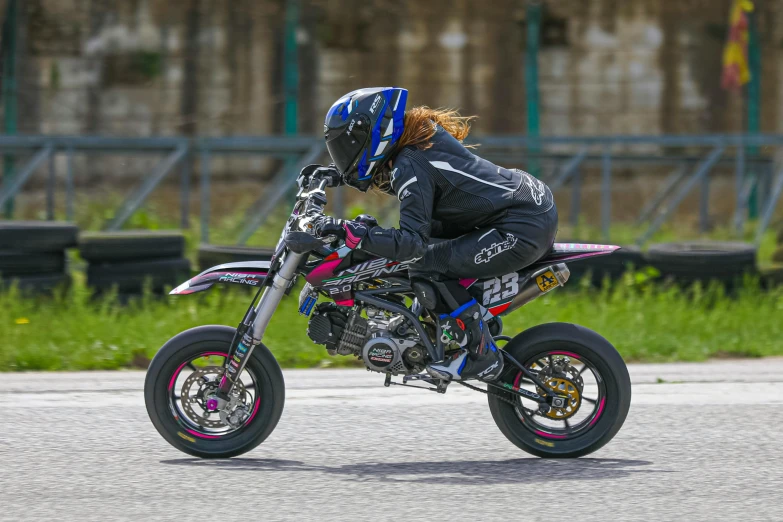 the motorbike rider is preparing for his turn