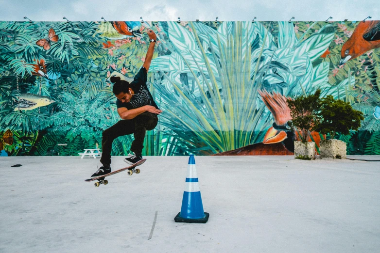 a skateboarder is doing tricks next to a wall