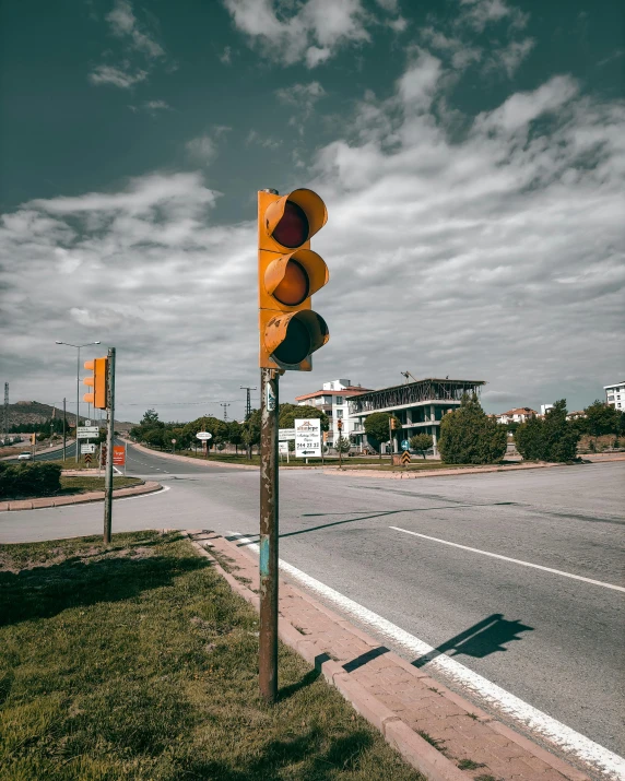 a traffic light is placed on the corner of the street