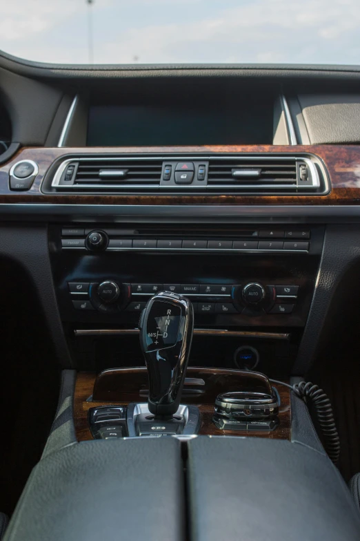 a brown and black car dashboard with controls and dash board