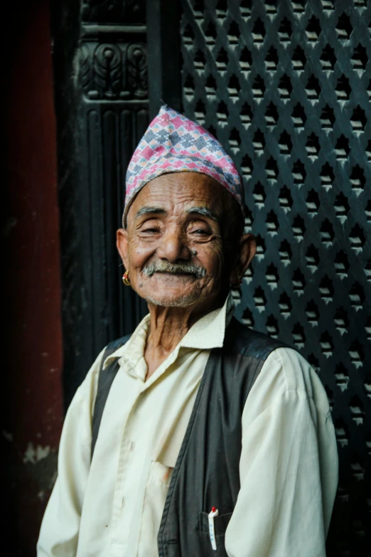 an old man with a mustache and a hat on