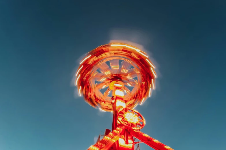 a ferris wheel lit up in the night