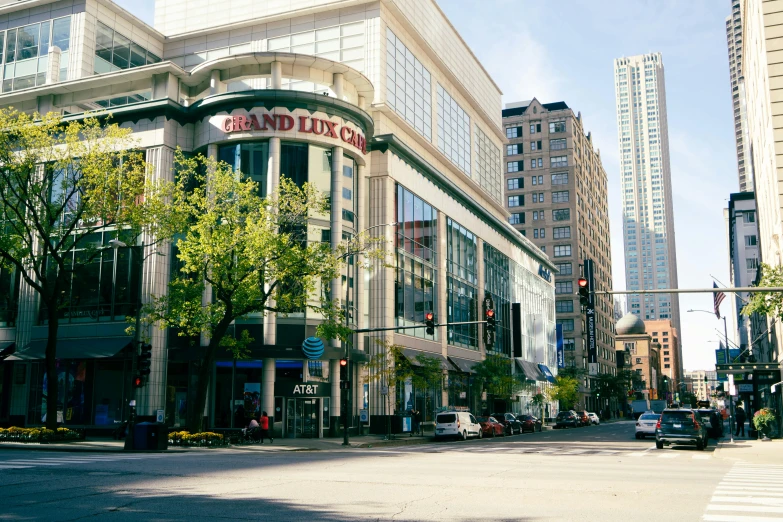 a corner intersection with lots of buildings and cars