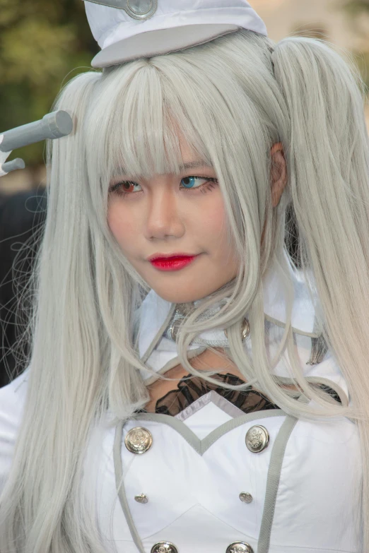 a white cosplay woman with blonde hair and bangs