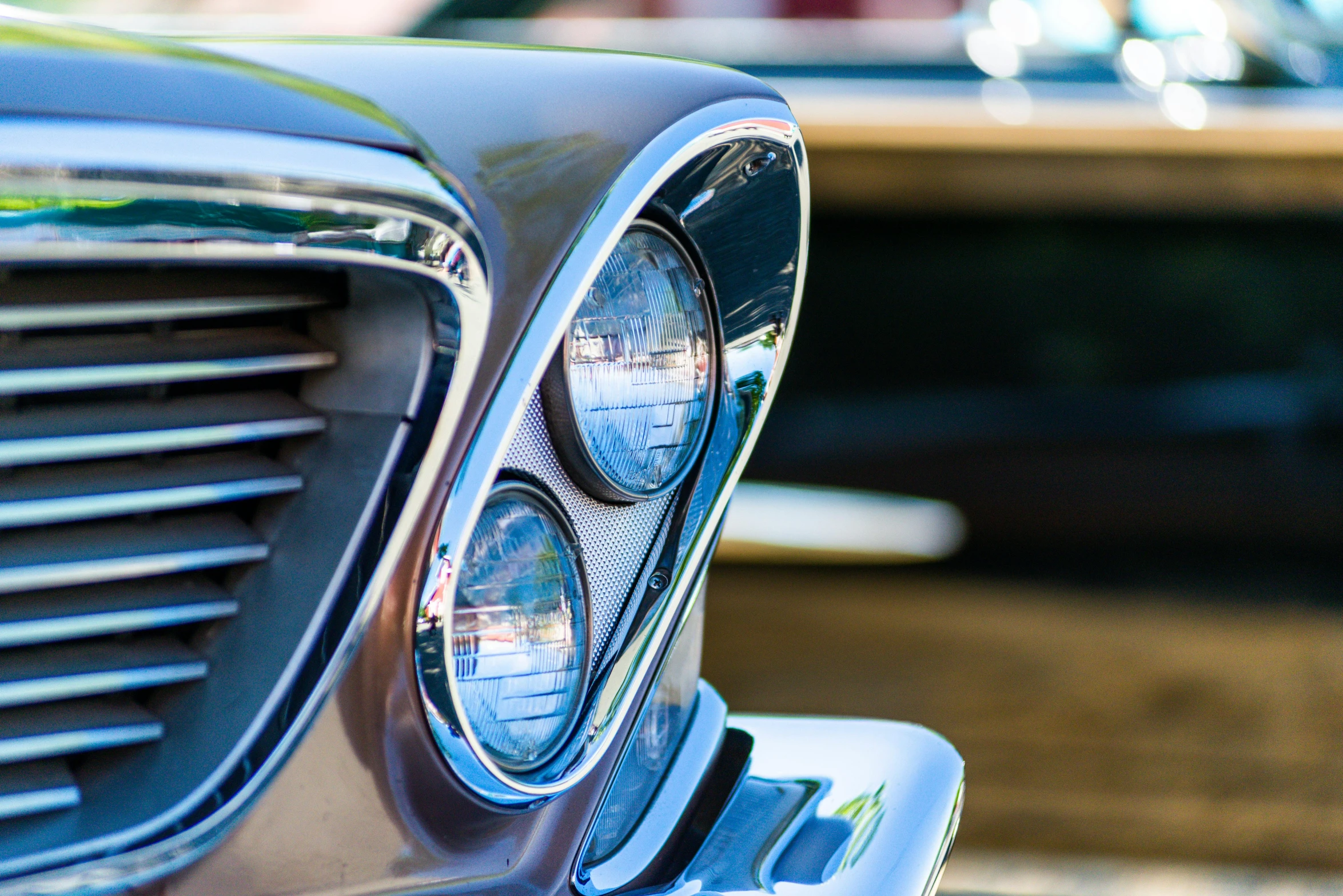 an old fashioned car front lights on it's grille