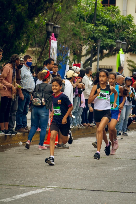 two children running the boston marathon