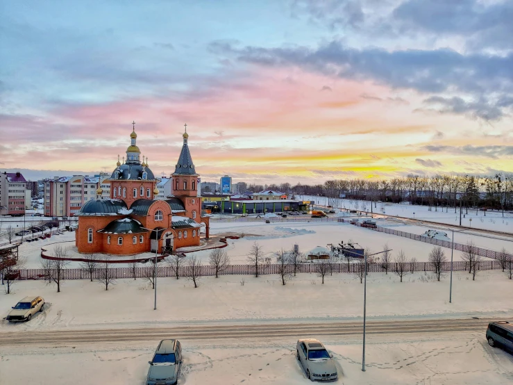 a large church on the top of a snowy hill