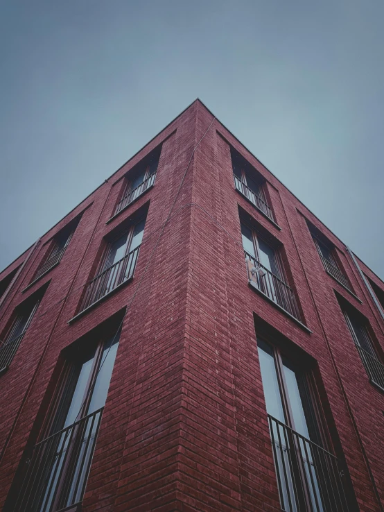 a very tall brick building with several windows