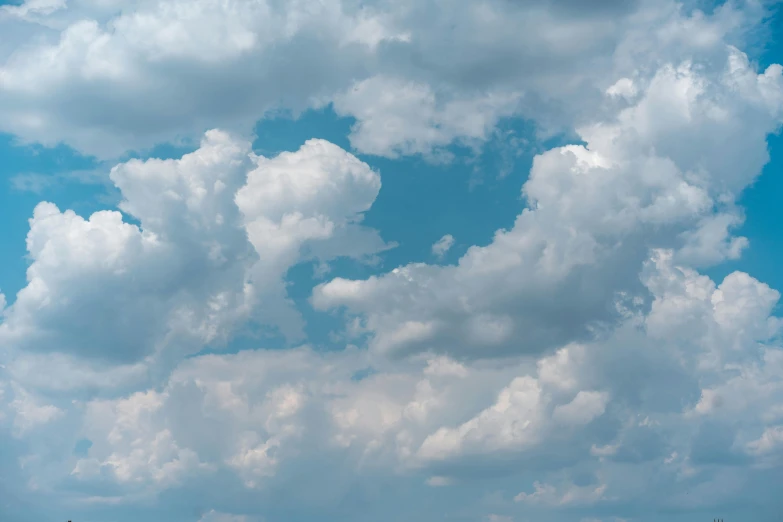 a large group of clouds that are blue and white