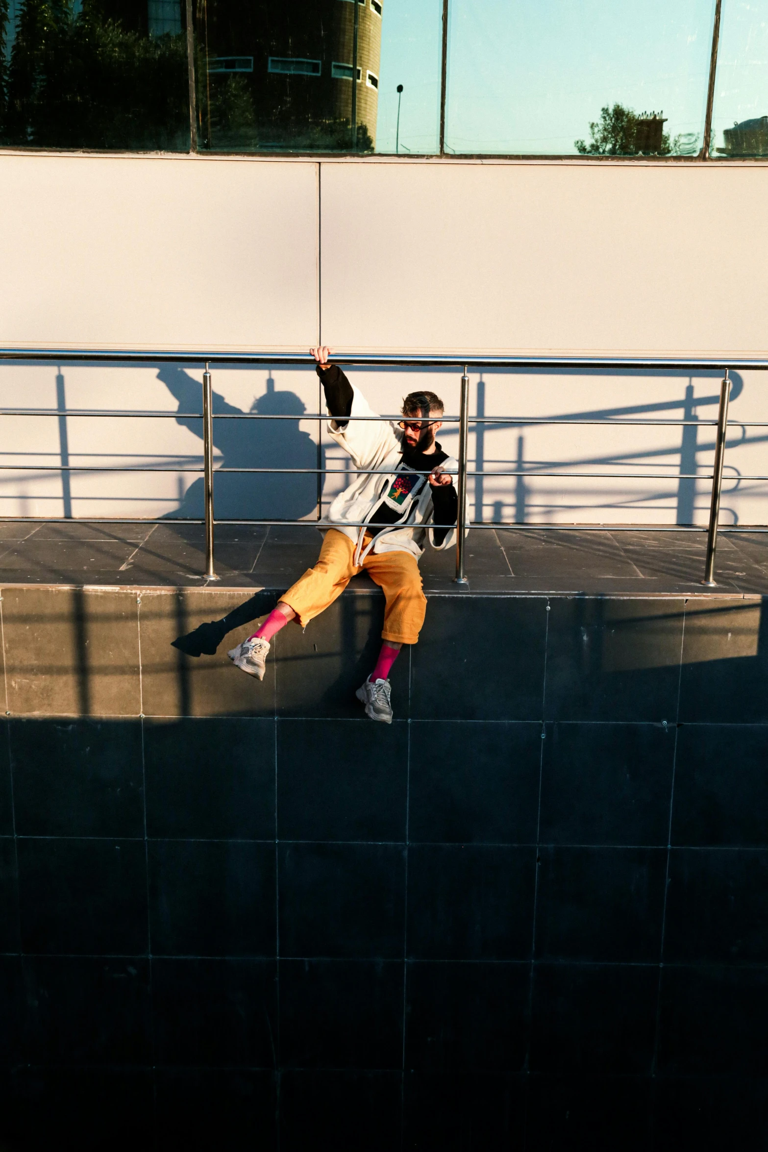 a girl sitting on steps holding a skateboard