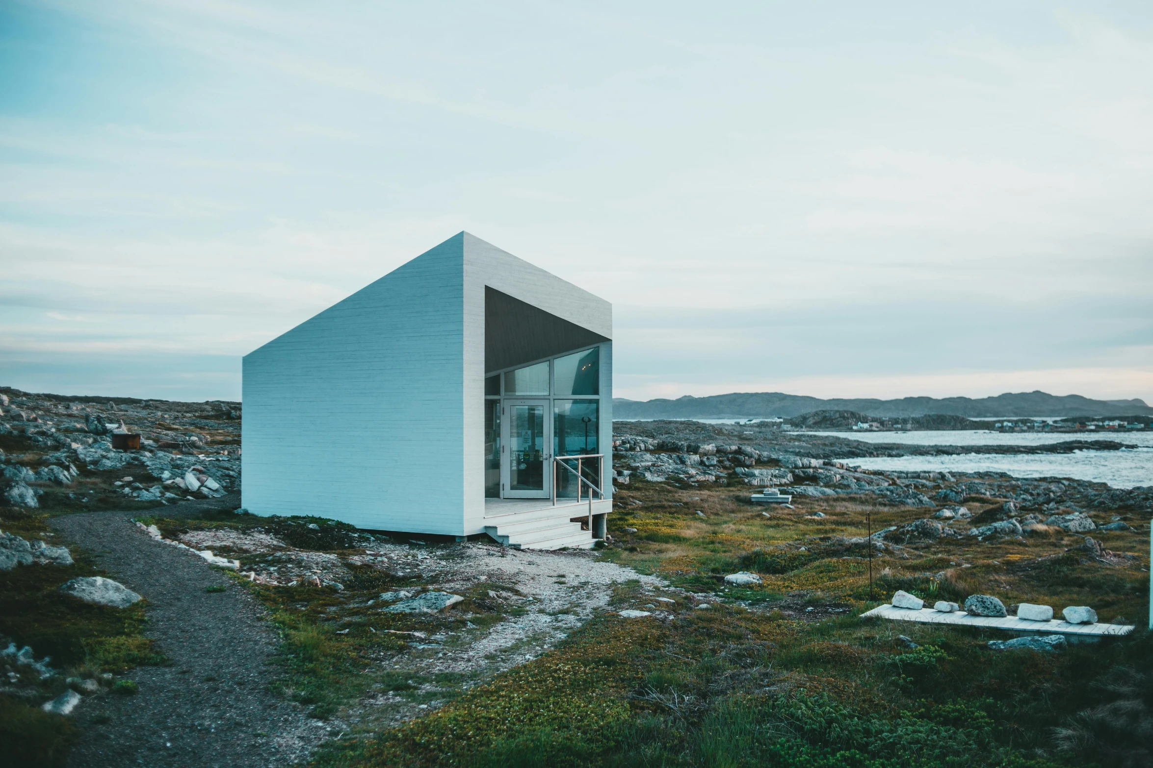 a house sits in the middle of a field