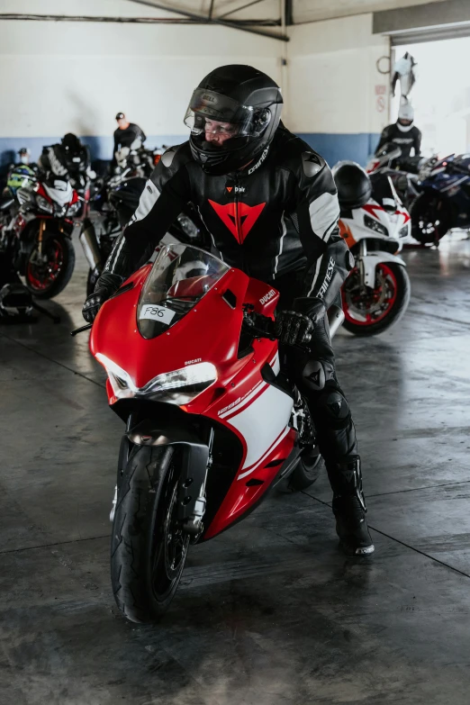 several people wearing helmets are riding on their motorcycles