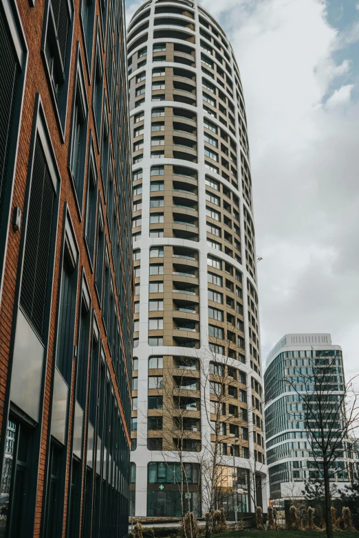 an urban city street lined with tall, curved buildings