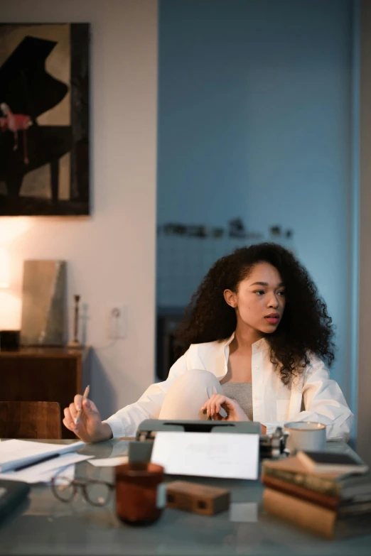 a woman seated at a desk in an office