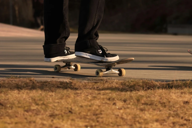 a skateboarder rides his skateboard down the street