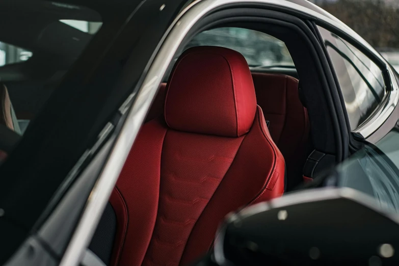 a red seats on the front of a vehicle