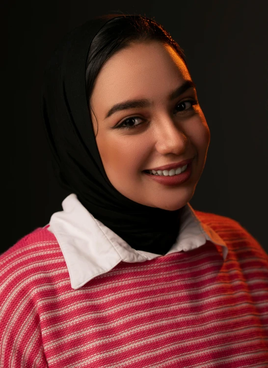 woman smiling wearing an oversize black veil