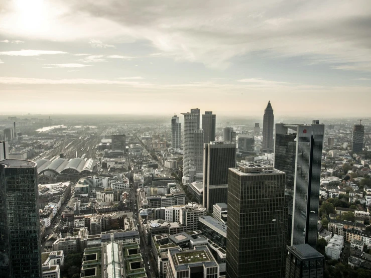 an overview of some tall buildings and cloudy sky