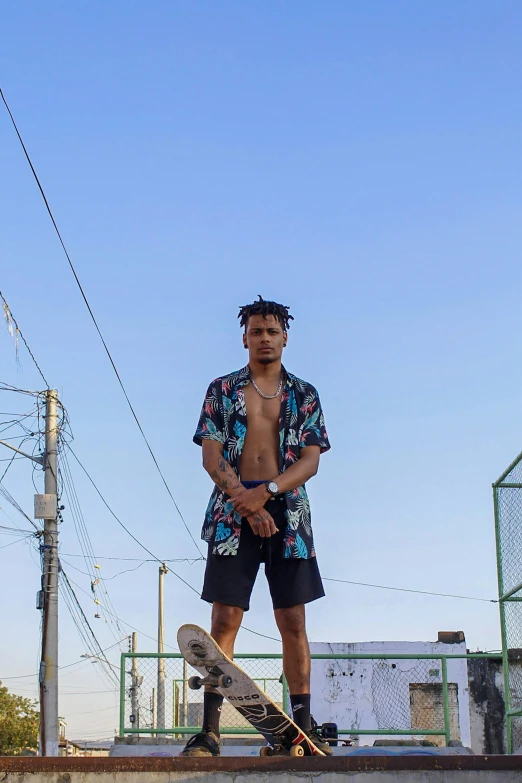 a shirtless man with  standing on a skateboard