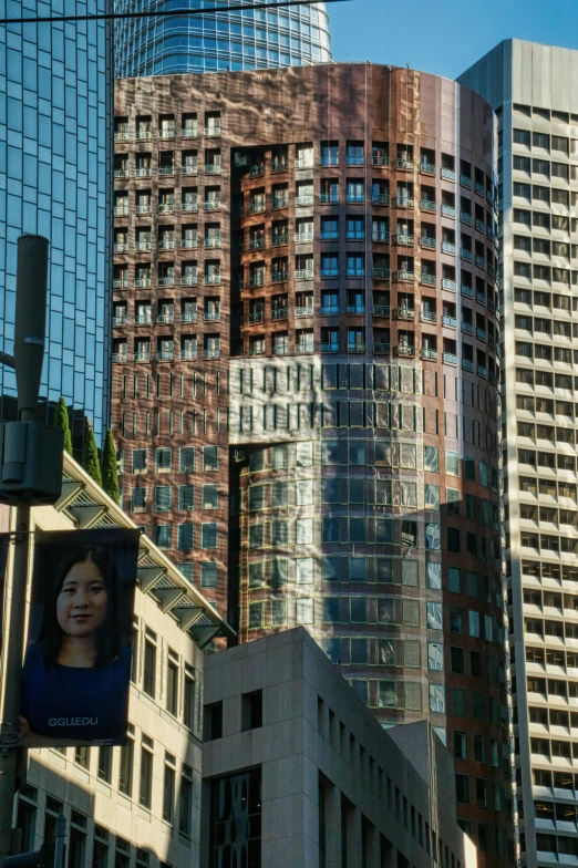 a row of tall buildings on the corner of a city street