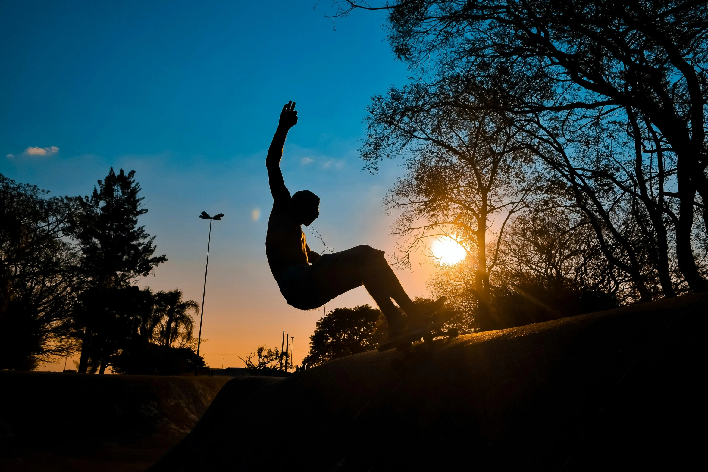 there is a skateboarder doing a trick in the air