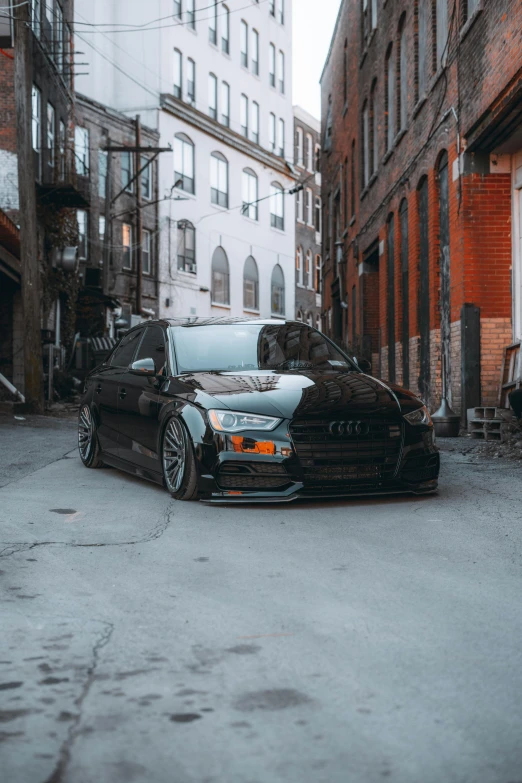 black car parked in the middle of a city street