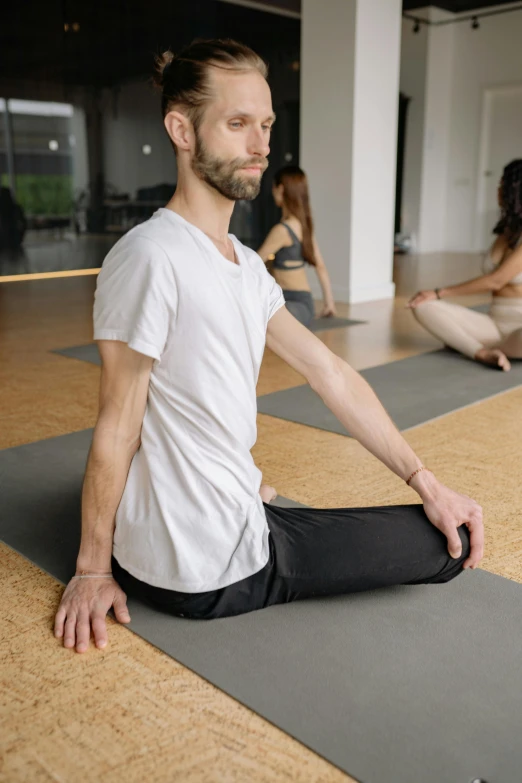 man with head turned in pain during meditation