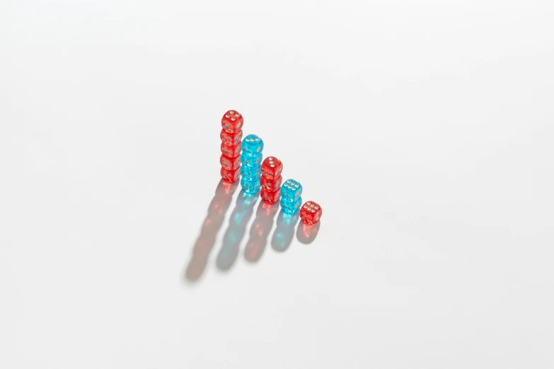 the four red and blue plastic toy blocks on the table