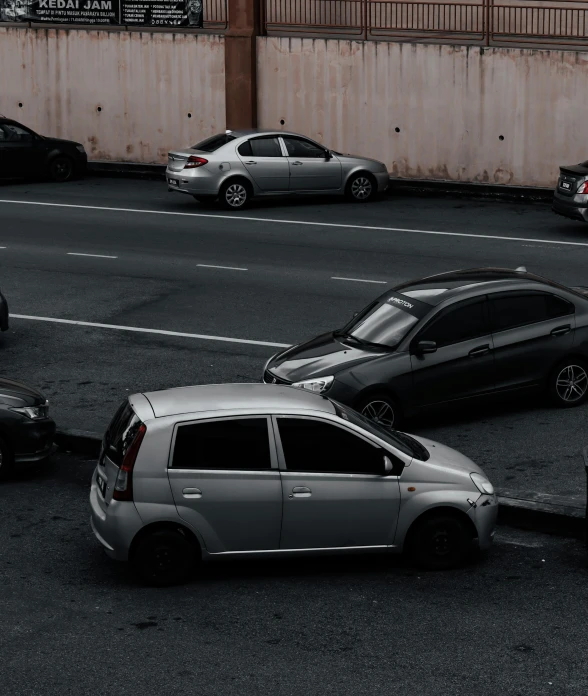 cars are stopped in a row on a road