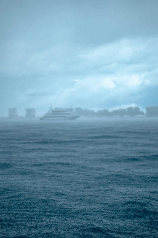 ship out at sea with sky and water