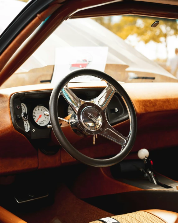 a dashboard on a old car with the sun shining