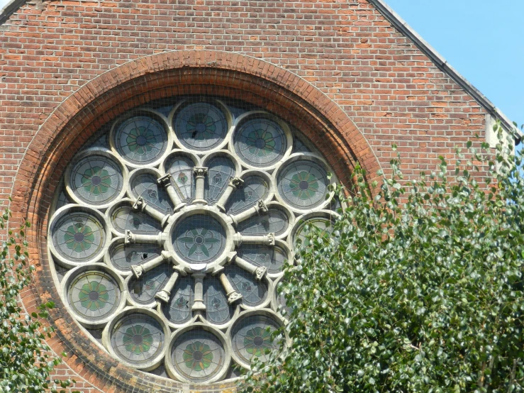 an old window sitting on top of a brick building