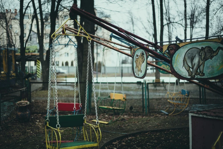 a playground with swings, swings, and swings in the park