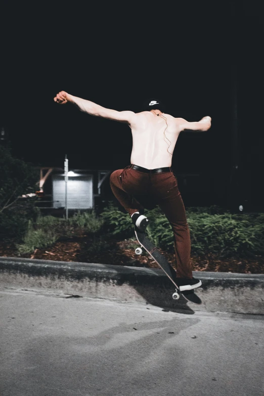 a man doing tricks on a skateboard outside