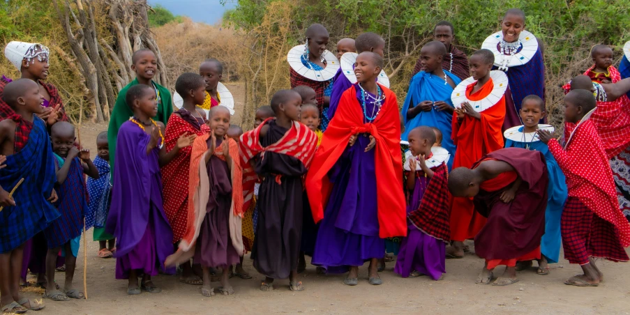 a group of young people wearing brightly colored dresses